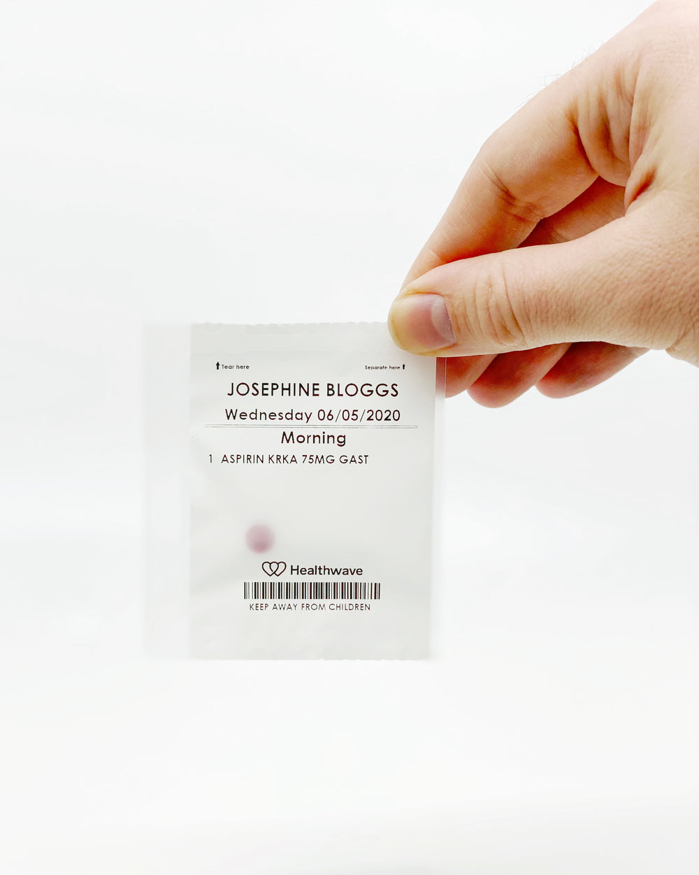 A PillPods pouch printed with the patient name, date and dose time